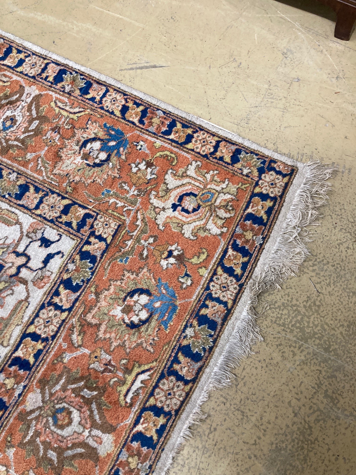 A modern Persian ivory ground rug, 340 x 260cm